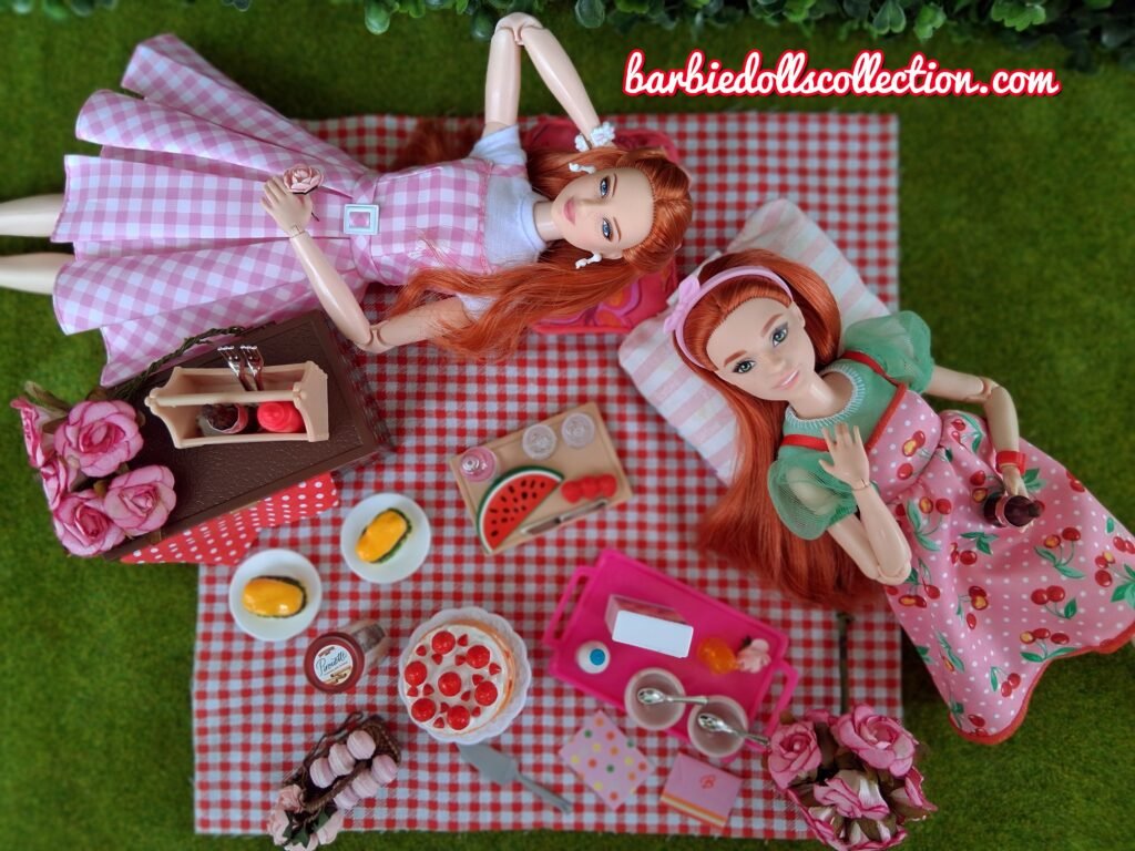 Two Barbie sisters relaxing on pillows and watching the clouds.