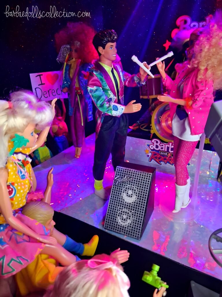 Barbie singing with Dereck on stage