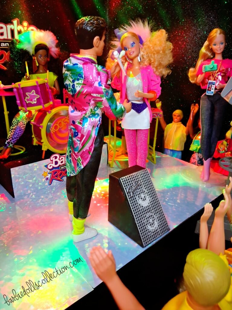 Barbie and Dereck singing together on stage