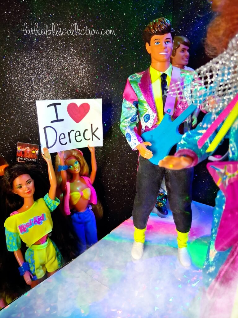 Dereck of Barbie and The Rockers standing full body on stage
