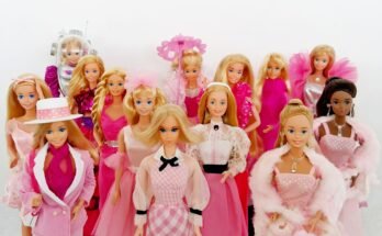 15 Barbie dolls dressed in pink for Breast Cancer Awareness Month